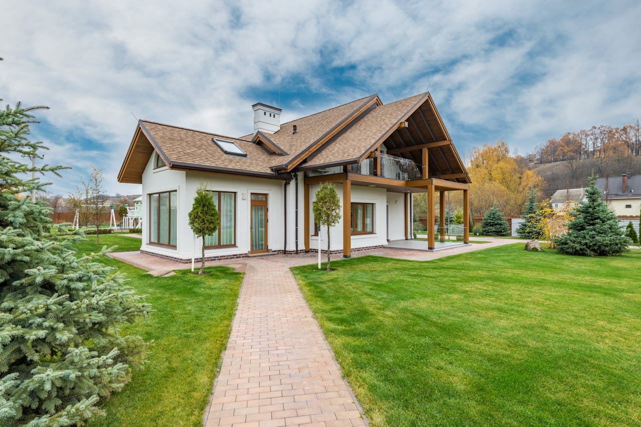 service-06 Contemporary house with a beautiful exterior and spacious lawn, set in a suburban area.